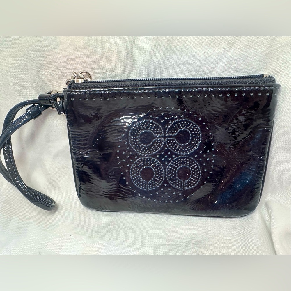 Dark blue leather Coach wristlet purse.